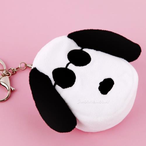 Stuffed Snoopy keychain on pink background.