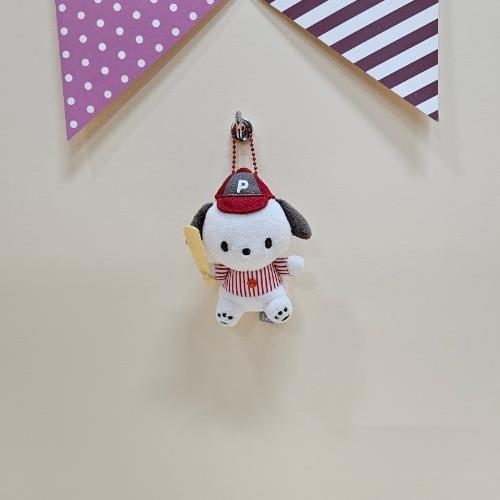 Stuffed, white dog keychain wearing red baseball cap and striped shirt, holding a bat.
