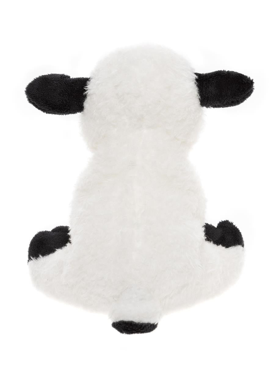White plush toy with black spots on a white background