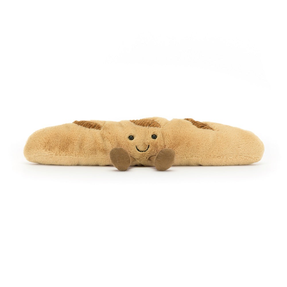 Stuffed plush baguette with embroidered face and attached legs.