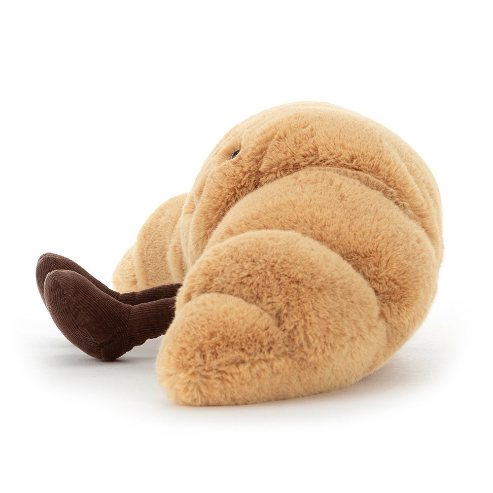 Stuffed plush croissant toy with corduroy legs.