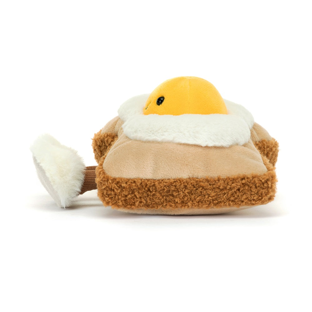 Stuffed yellow egg wearing a brown jacket with white faux fur trim.