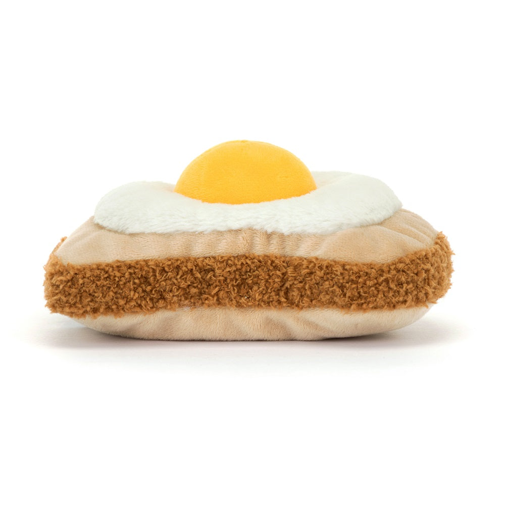 Stuffed egg-shaped pillow with yellow yolk, white frill, and brown shaggy band.