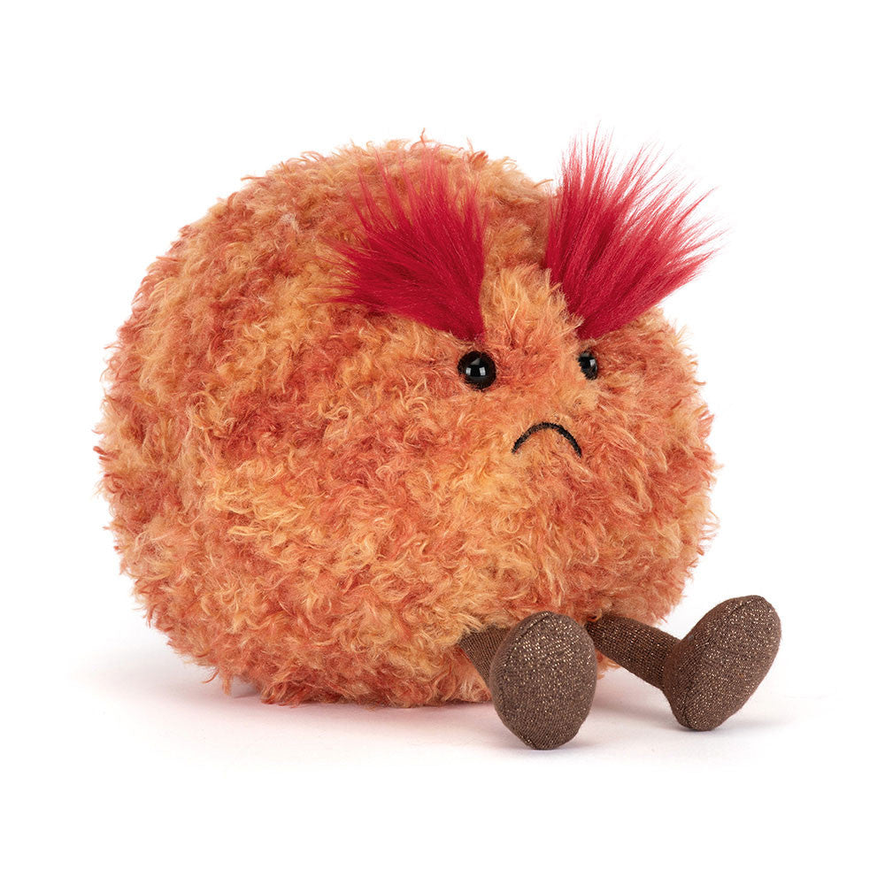 Orange fuzzy plush planet Mars toy by Jellycat with red spiky hair, black beady eyes, sad stitched mouth, and brown textured legs, front view.