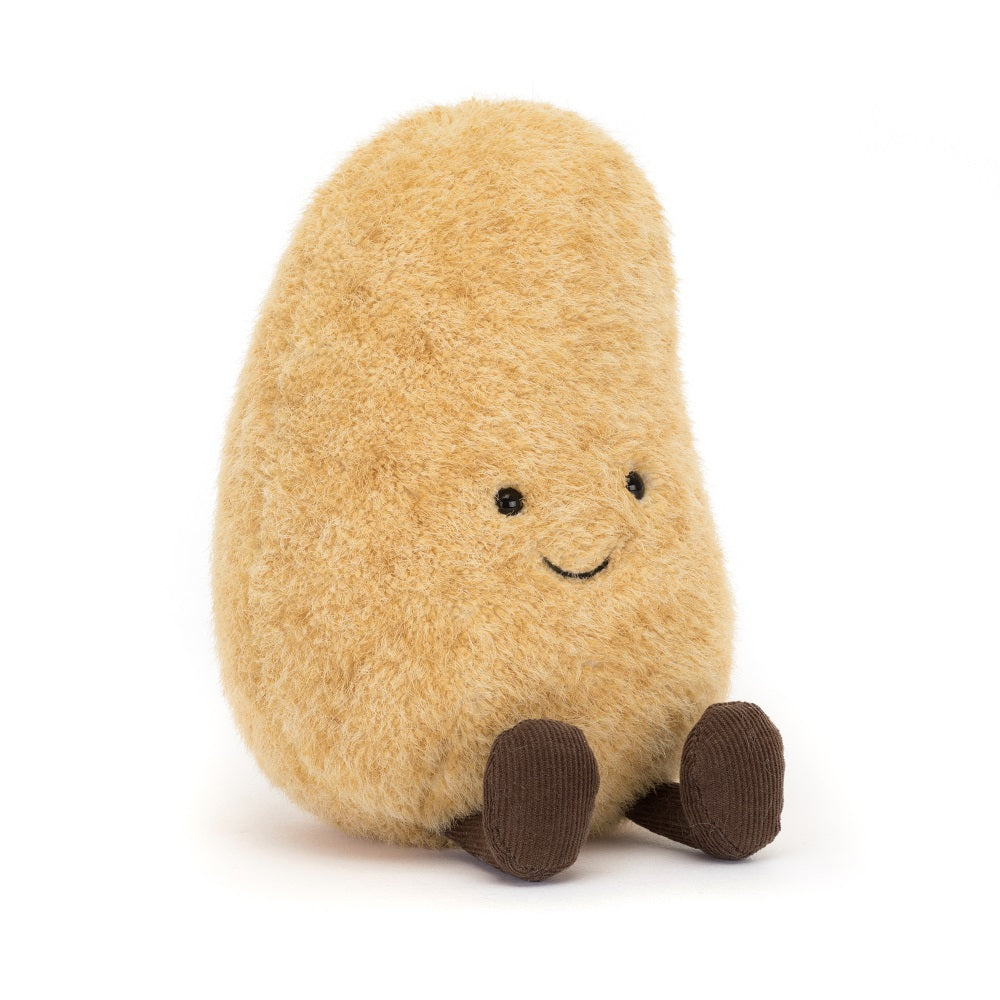Tan, potato-shaped plush toy with brown corduroy feet and a smiling face.