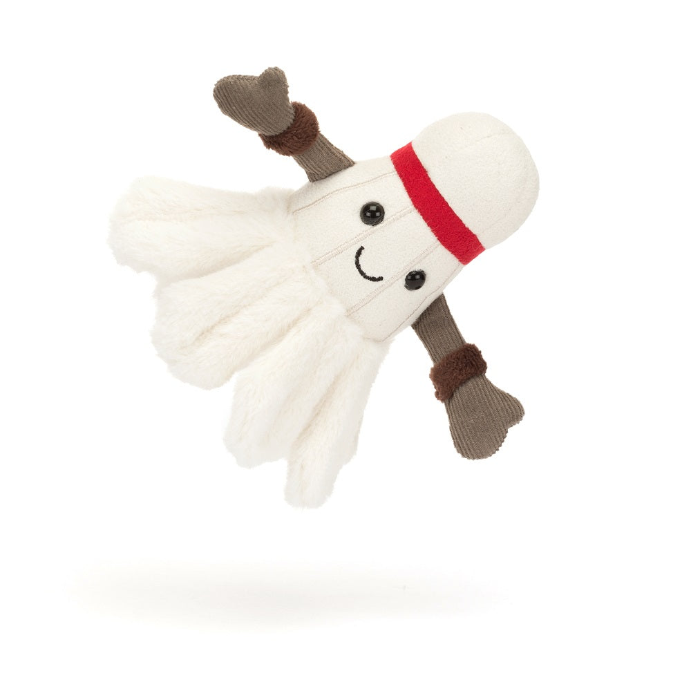 Stuffed badminton shuttlecock toy with a smiling face and red band.