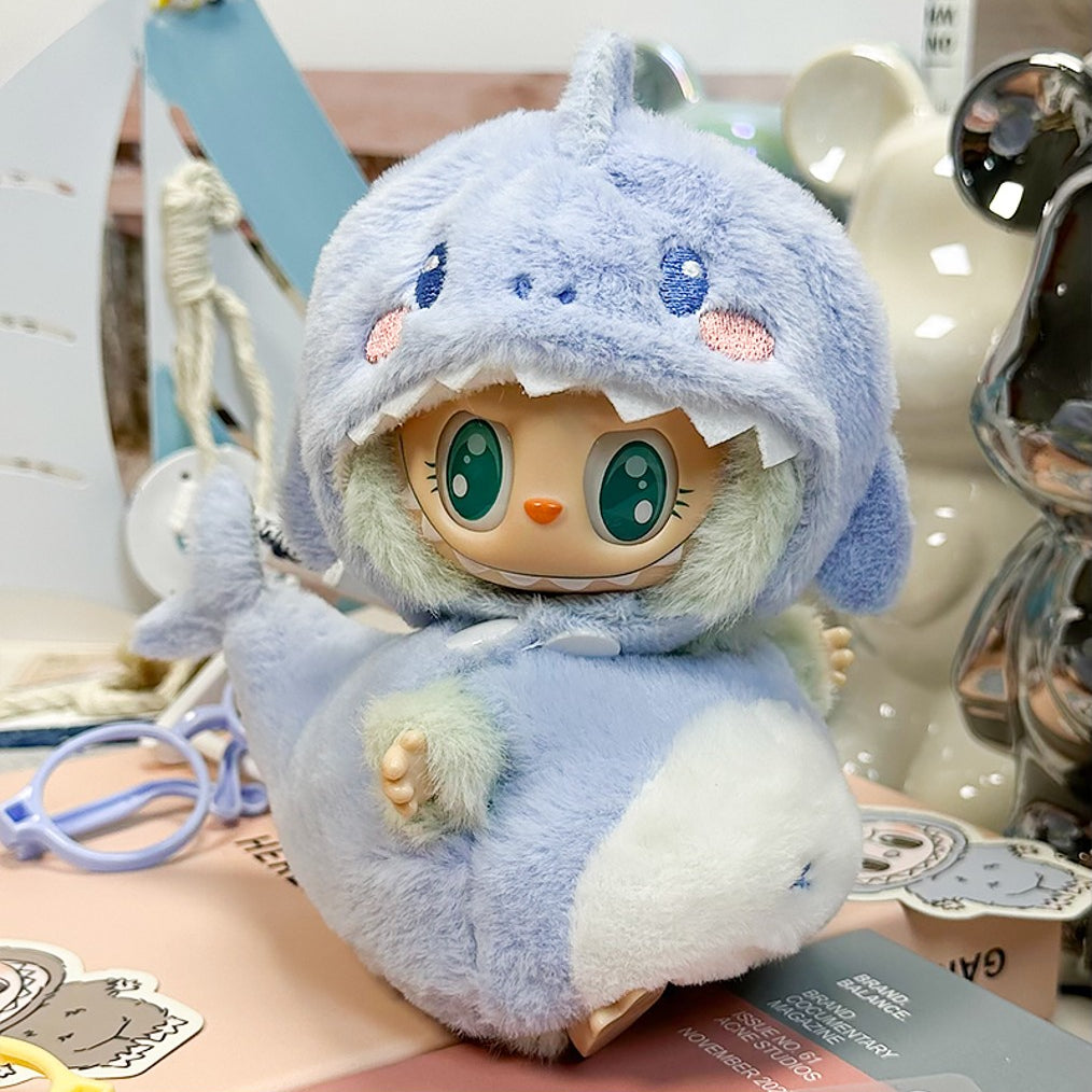 Cute, plush, light-blue shark doll.
