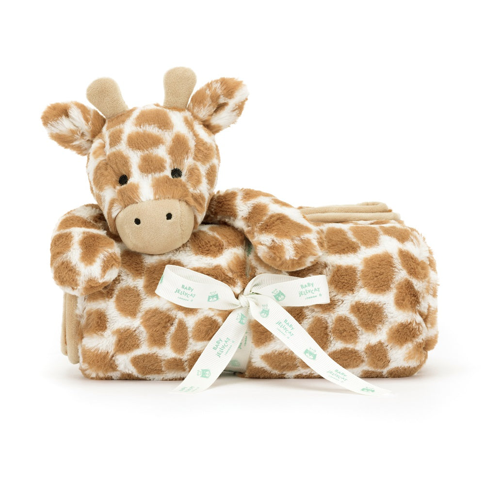 Stuffed giraffe toy with a white ribbon.