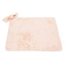Peach bunny lovey on a peach faux fur baby blanket.