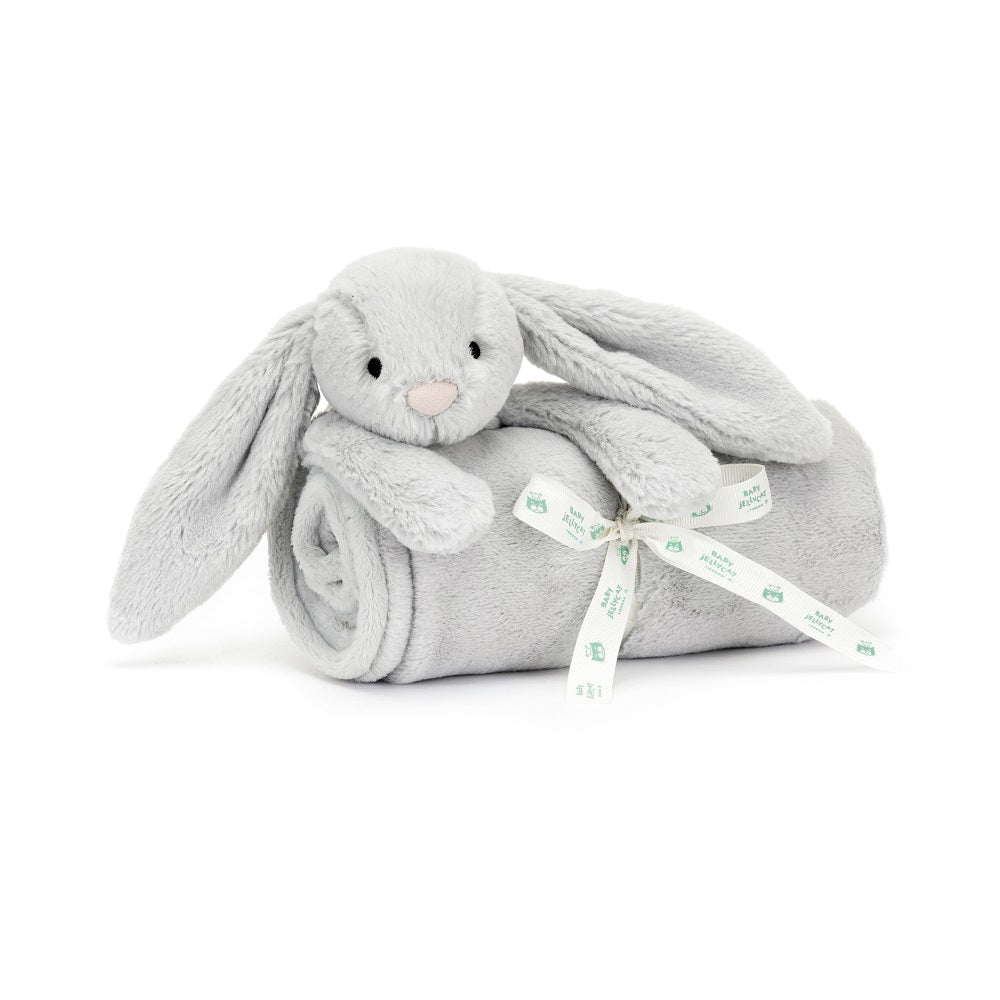 Gray bunny stuffed animal wrapped in a gray blanket with a white ribbon.