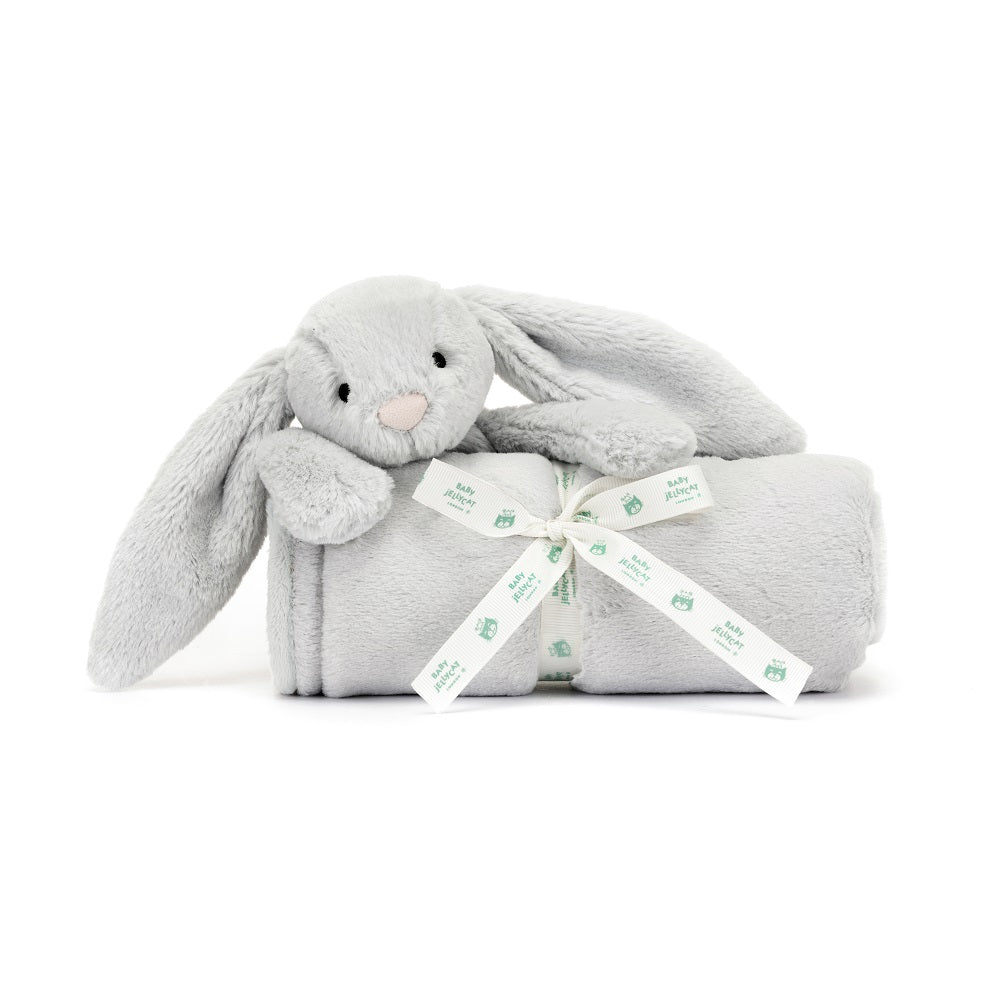 Gray stuffed bunny rabbit on a rolled blanket tied with a "Baby Jellycat" ribbon.