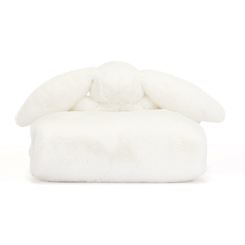 White plush bunny-shaped cushion.