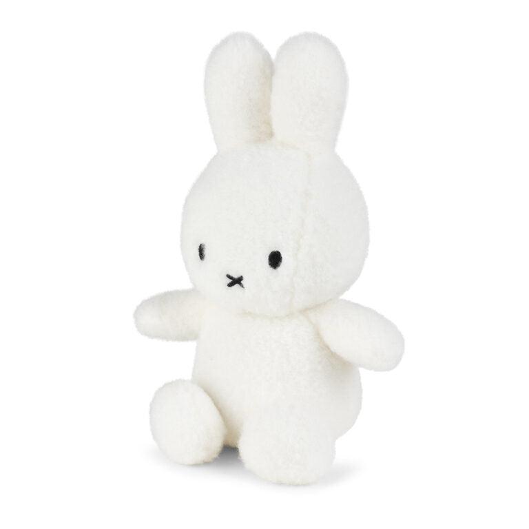 White Miffy plush bunny toy sitting upright.