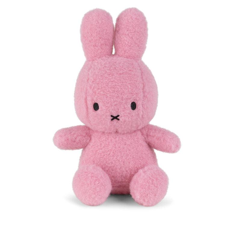 Pink plush bunny with stitched X mouth.