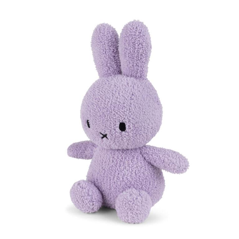 Lilac Miffy plush toy sitting.