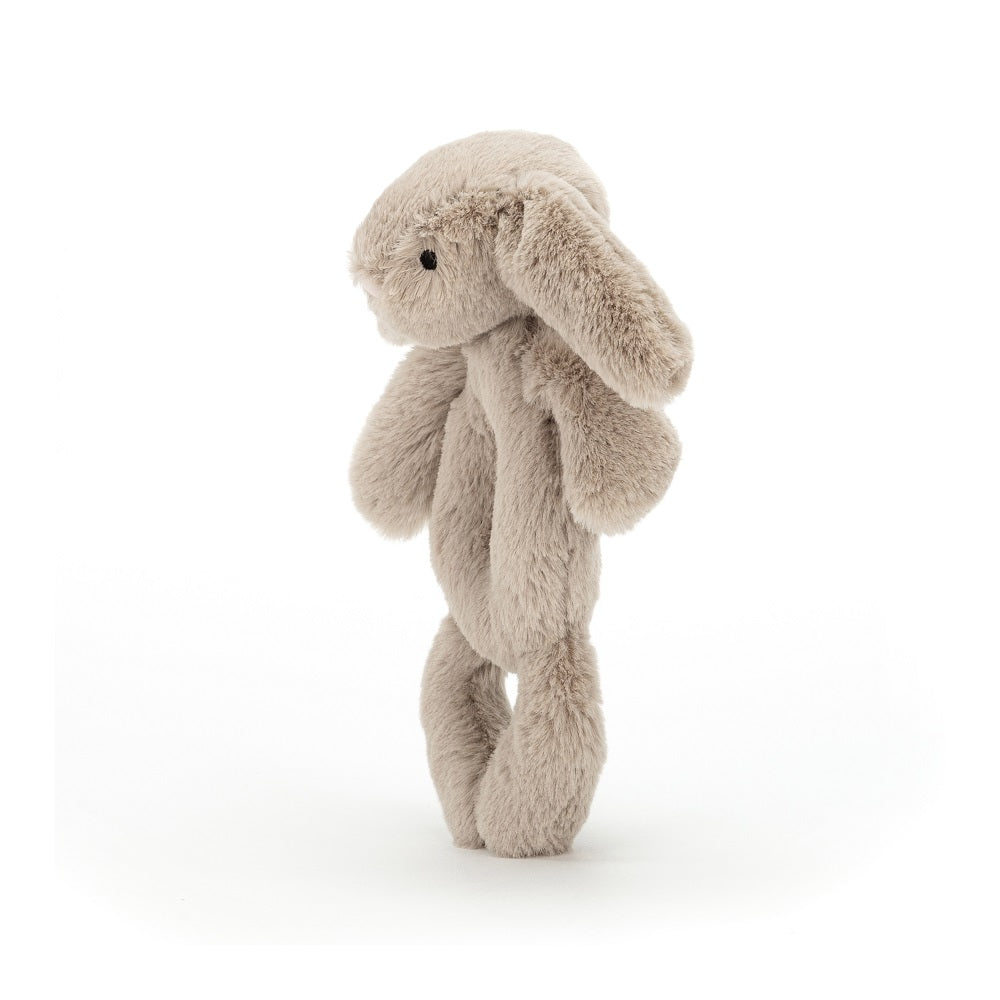 Light brown plush bunny standing.