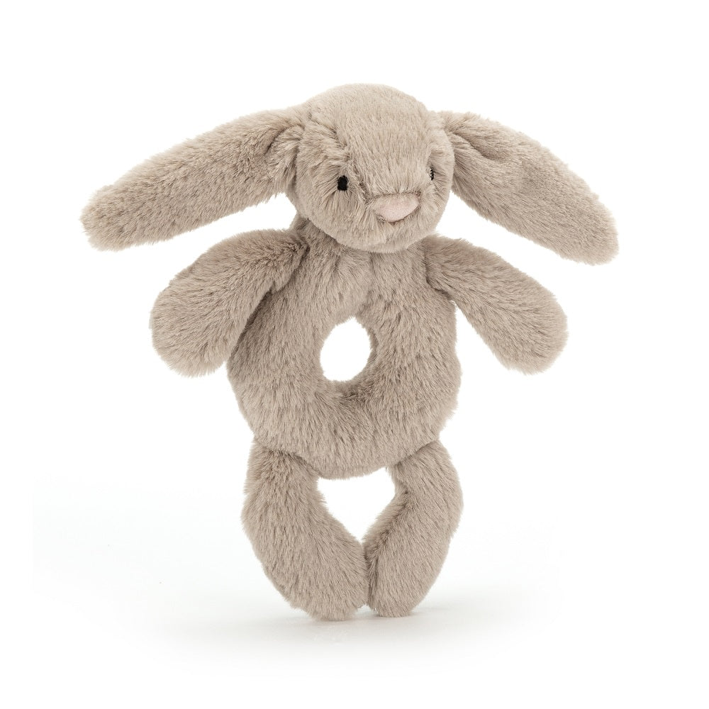 A light brown plush bunny baby rattle.