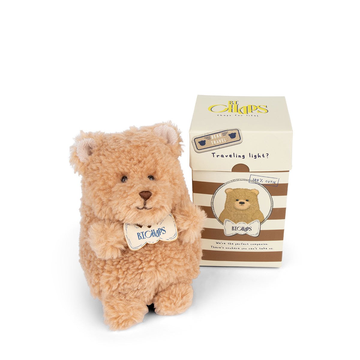 A tan teddy bear stands next to a matching box.