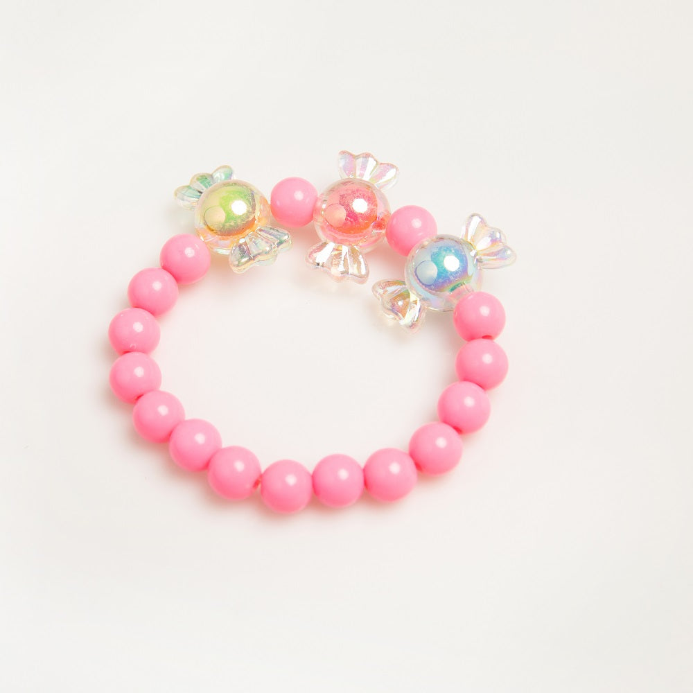 A pink beaded bracelet with candy-shaped charms.