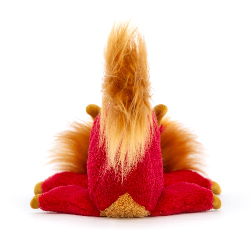 Rear view of a red plush toy with a golden mane and tail.