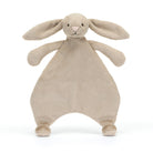 Beige stuffed rabbit with long ears.