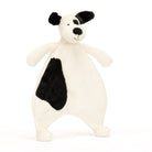 Stuffed, white, plush dog toy with black spots and ears.