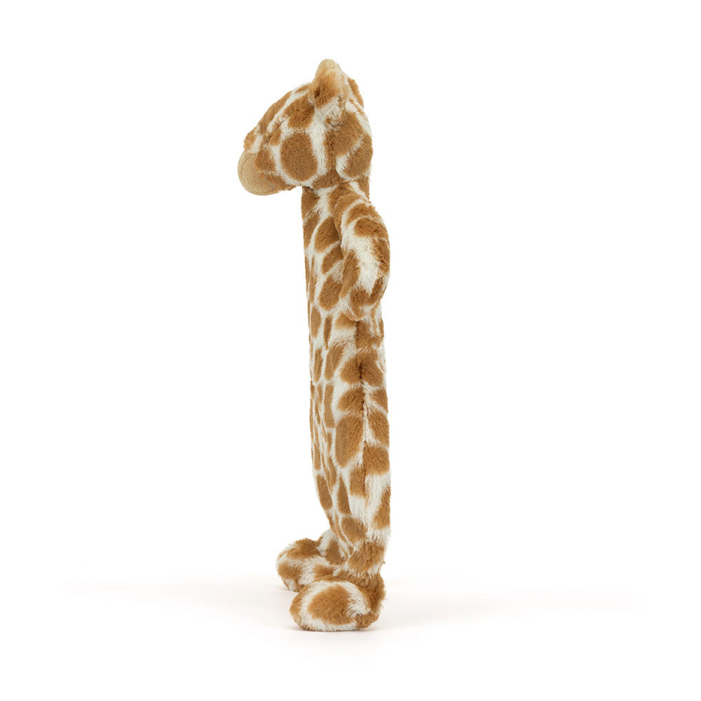 Stuffed giraffe toy with brown and white spots.