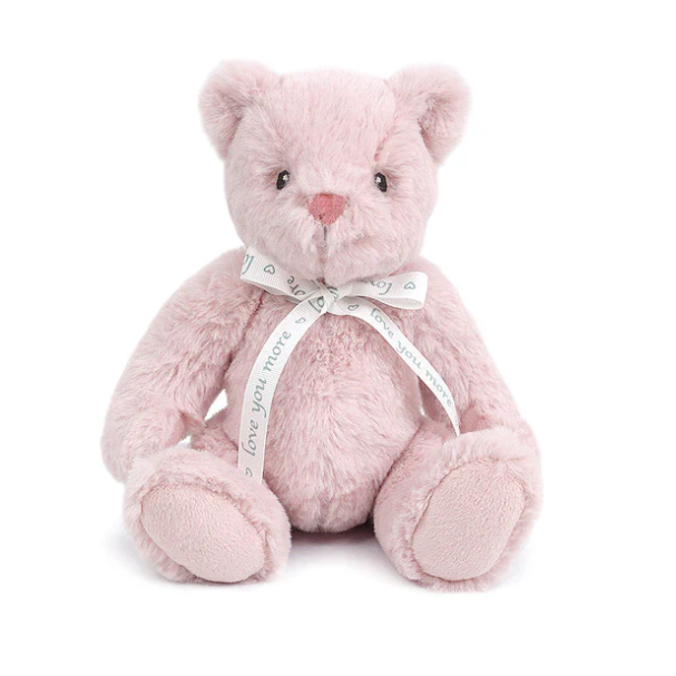 Pink teddy bear with a bow on a white background