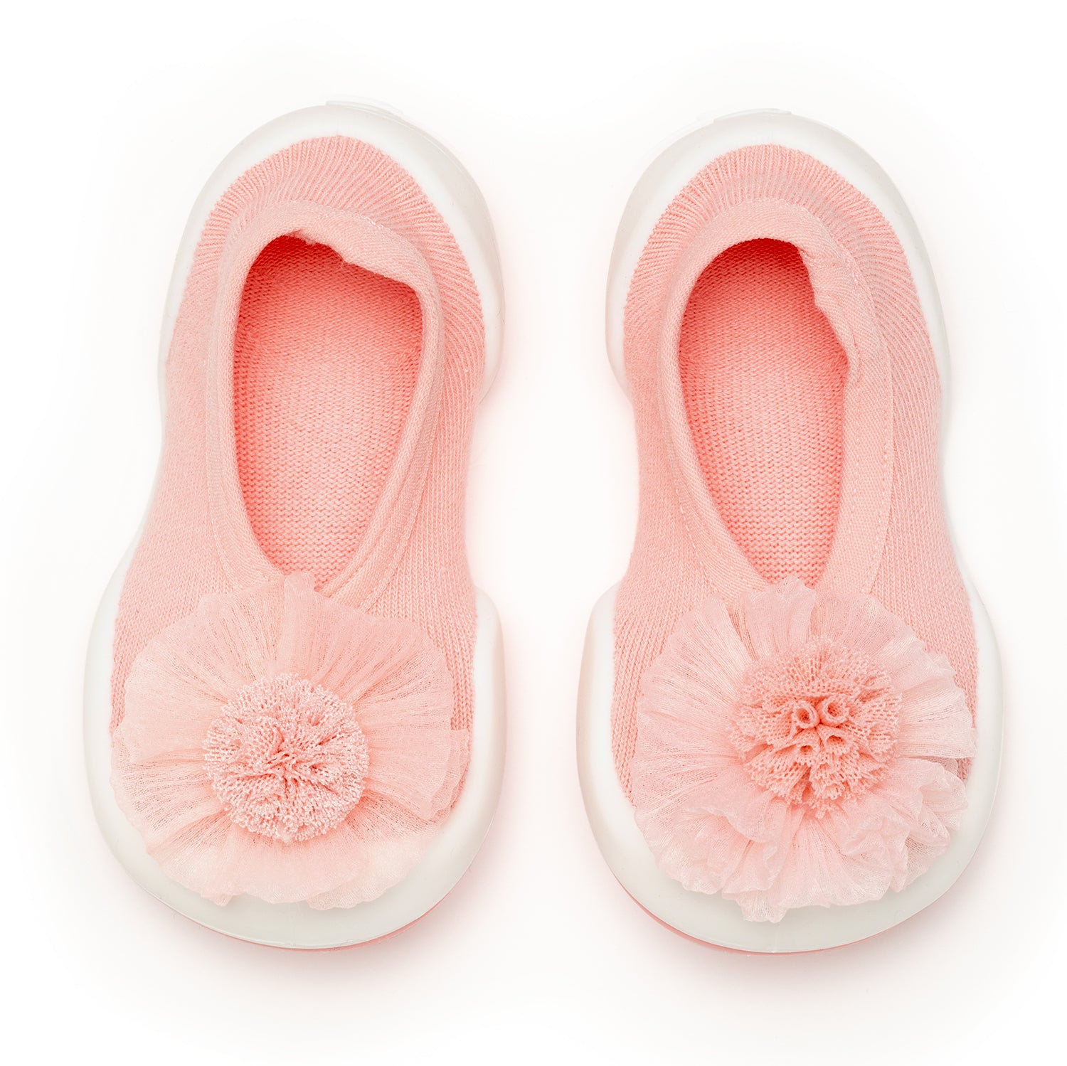 Pair of pink baby slippers with tulle flower detail.