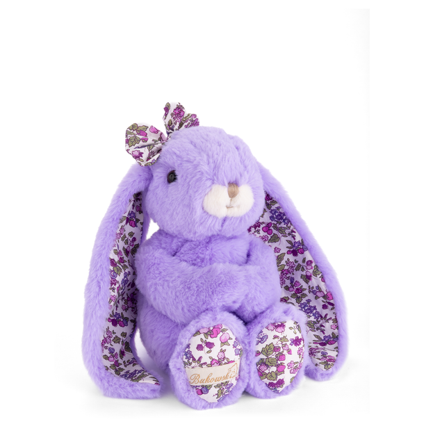 Purple plush bunny with floral patterns on a white background