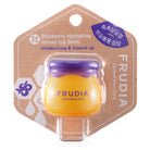 Lip balm in honey pot container in packaging.