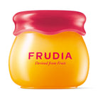 Jar of Frudia fruit-derived beauty product with a red lid.