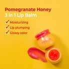 Close-up of Frudia Pomegranate Honey 3 in 1 Lip Balm with product swatch on yellow background.