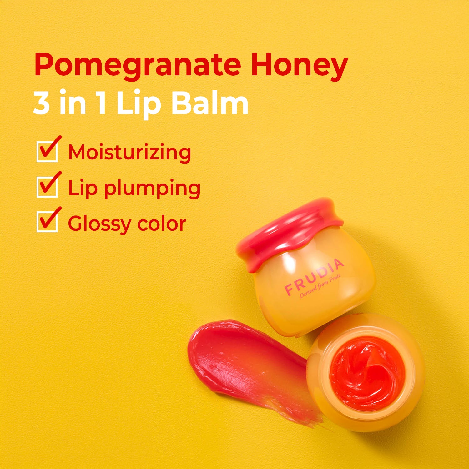 Close-up of Frudia Pomegranate Honey 3 in 1 Lip Balm with product swatch on yellow background.