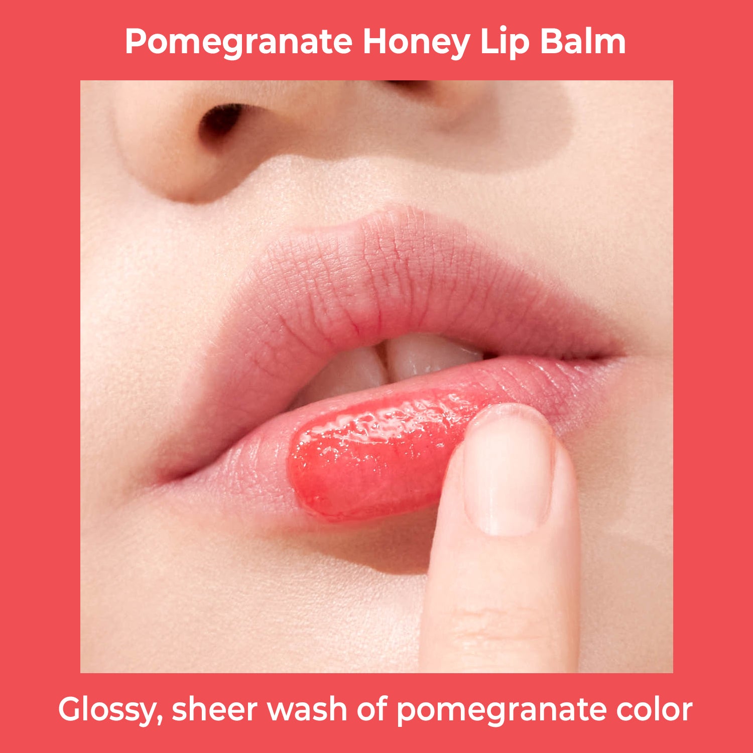 Close-up of lips with pomegranate honey lip balm being applied.