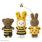 Crocheted stuffed bear, Miffy bunny in yellow bee costume, and Miffy bunny in yellow flower dress.