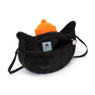 Black furry purse with orange hat.