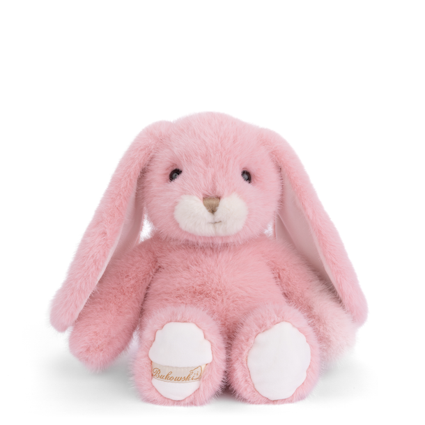 Pink plush bunny toy with a visible brand logo on a white background