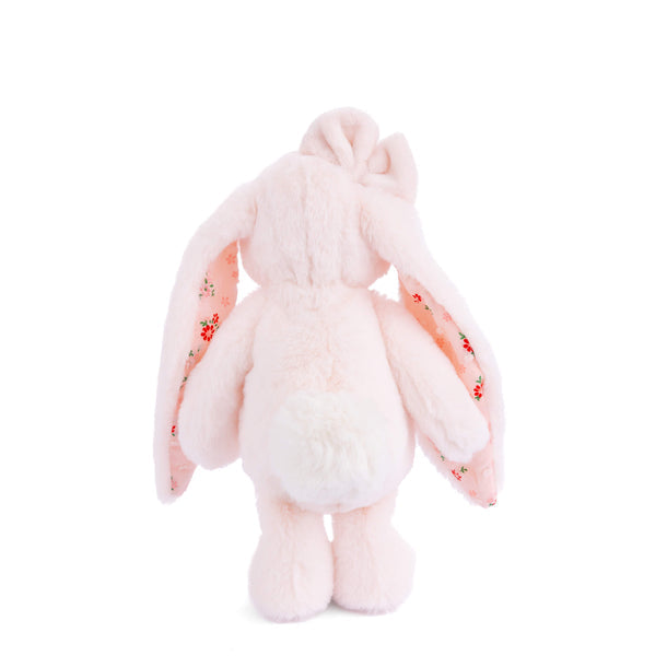 Pink plush bunny toy with embroidered details on a white background