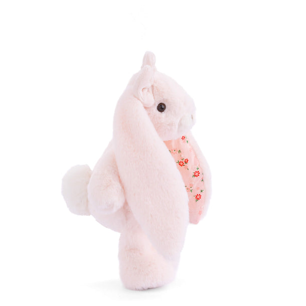 Plush bunny with floral pattern on a white background