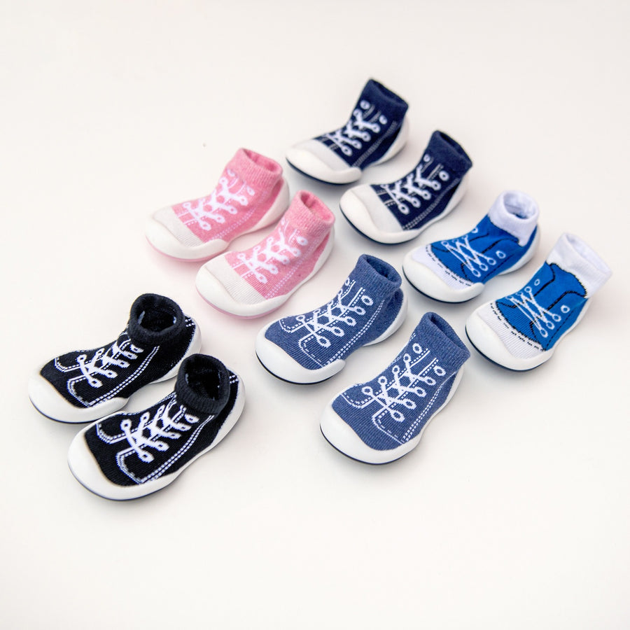 An assortment of colorful baby shoe socks.