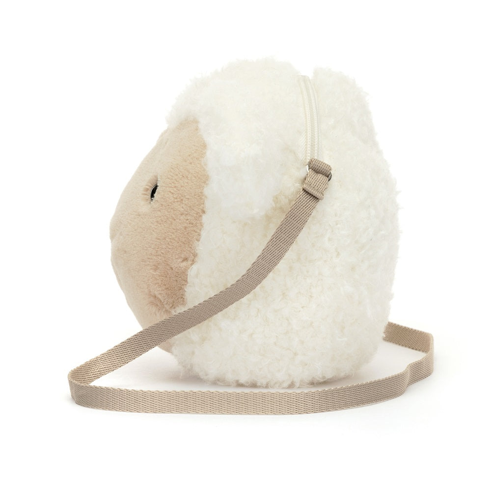 White, fuzzy, sheep-shaped purse with beige strap and zipper.