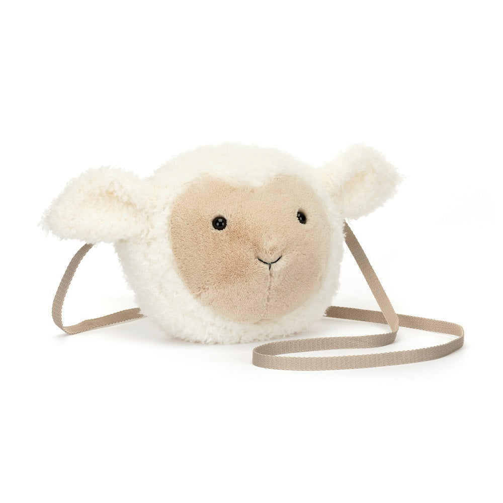A cream-colored plush lamb purse with a beige strap.