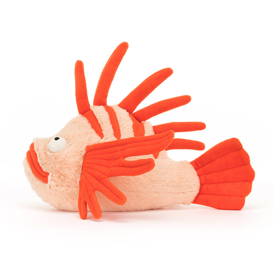 Stuffed lionfish toy, orange and peach.
