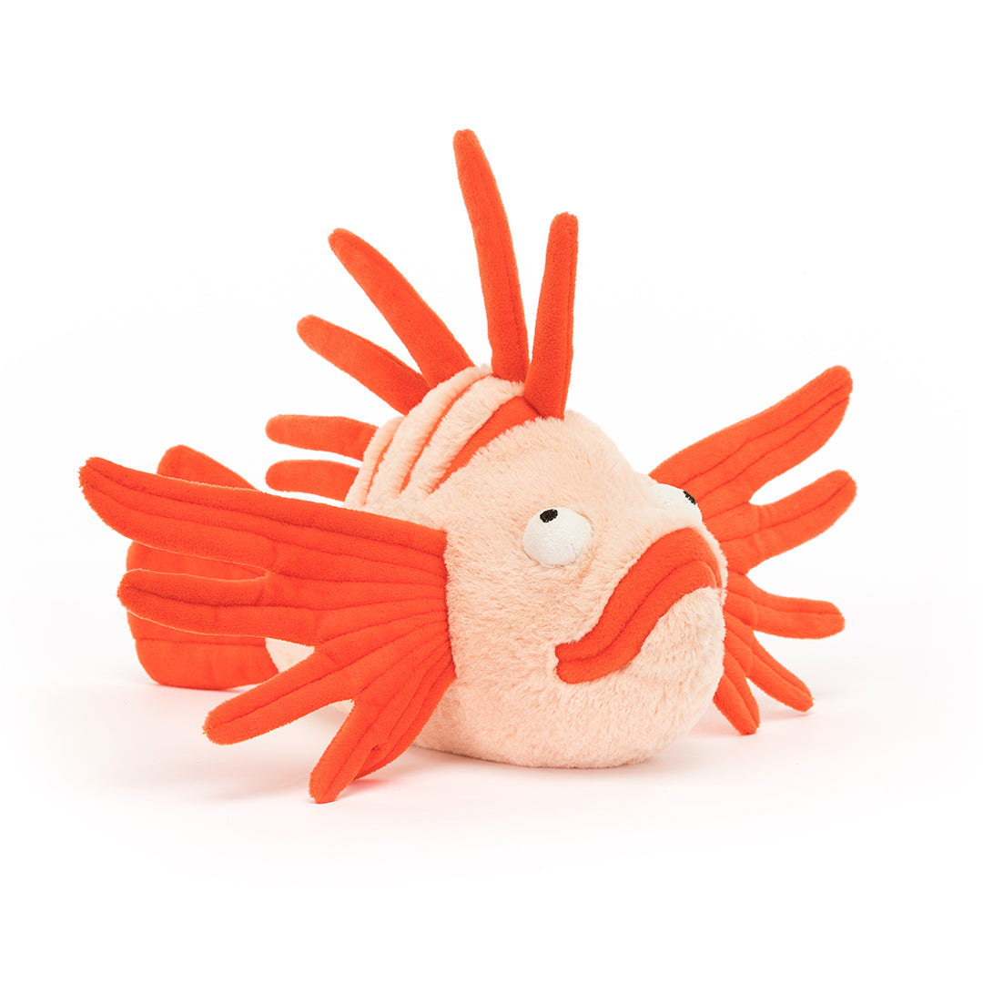 Stuffed plush orange and peach lionfish toy.