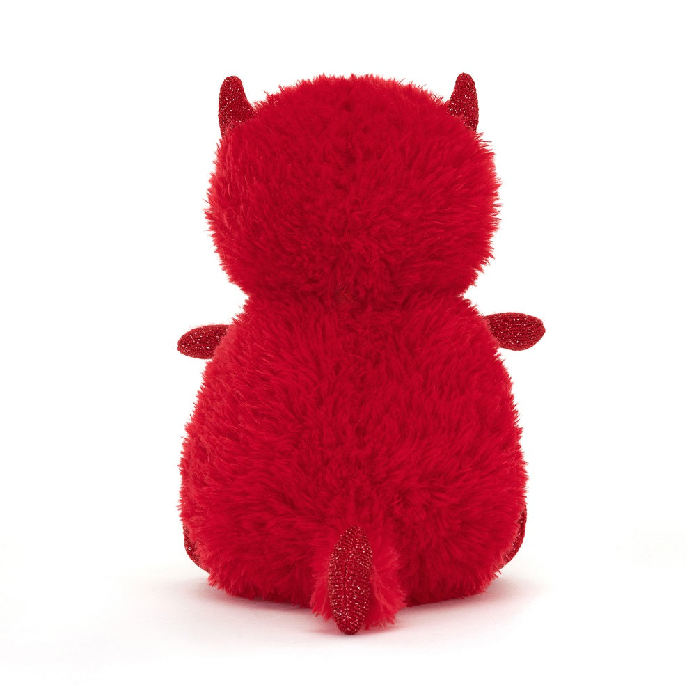 Rear view of a red fuzzy plush devil toy.