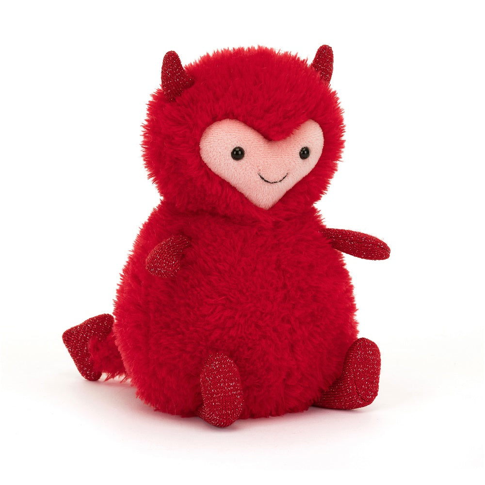 Red furry devil plush toy sitting.