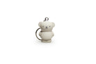 A gray bear-shaped keychain with a metal ring.