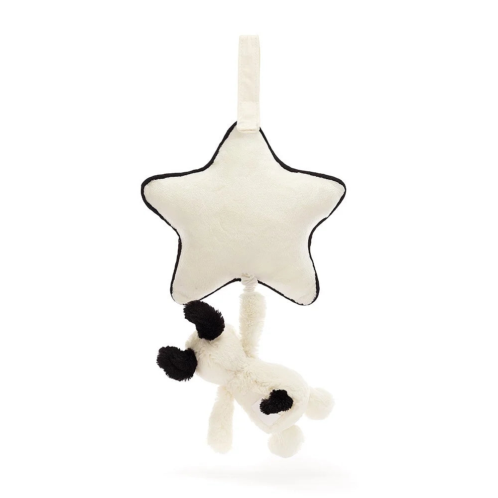 White plush star and spotted cow mobile.