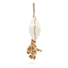 Stuffed giraffe hanging from a cream-colored toy.